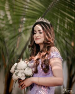 Bride with natural make up look for wedding, featuring soft pink tones and subtle highlights.