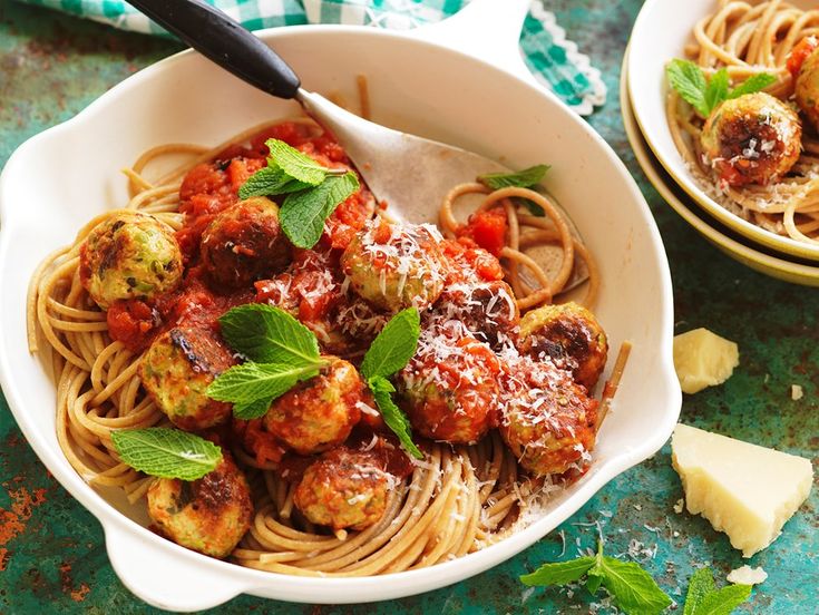 "A step-by-step visual guide on how to make herb-infused spaghetti. The image shows a kitchen counter with ingredients like fresh herbs, garlic, and olive oil arranged neatly. In the center, there’s a pot of boiling spaghetti. Next to it, a skillet with simmering herbs in olive oil, releasing their aromas. The final section displays a plated dish of spaghetti garnished with finely chopped herbs, offering a visual tutorial on infusing spaghetti with flavorful herbs."