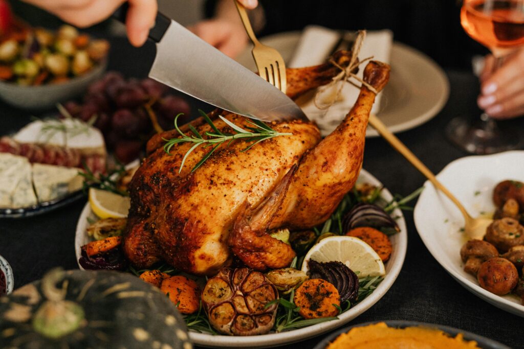 A beautifully plated Baked Lemon Garlic Chicken breast, garnished with fresh herbs, showcasing one of the delicious chicken breast recipes for beginners. The chicken is golden and succulent, served alongside vibrant roasted vegetables, emphasizing the simplicity and flavor of easy chicken breast recipes.