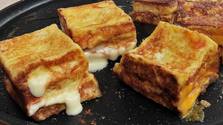 Image of sliced bread being soaked evenly in a mixture of eggs, milk, and spices, the key step in preparing French Toast. The bread absorbs the liquid without becoming soggy, ensuring a perfect, golden-brown French Toast with a soft interior and crispy edges after cooking."

This keeps "French Toast" as the focus while explaining the soaking process for clarity.