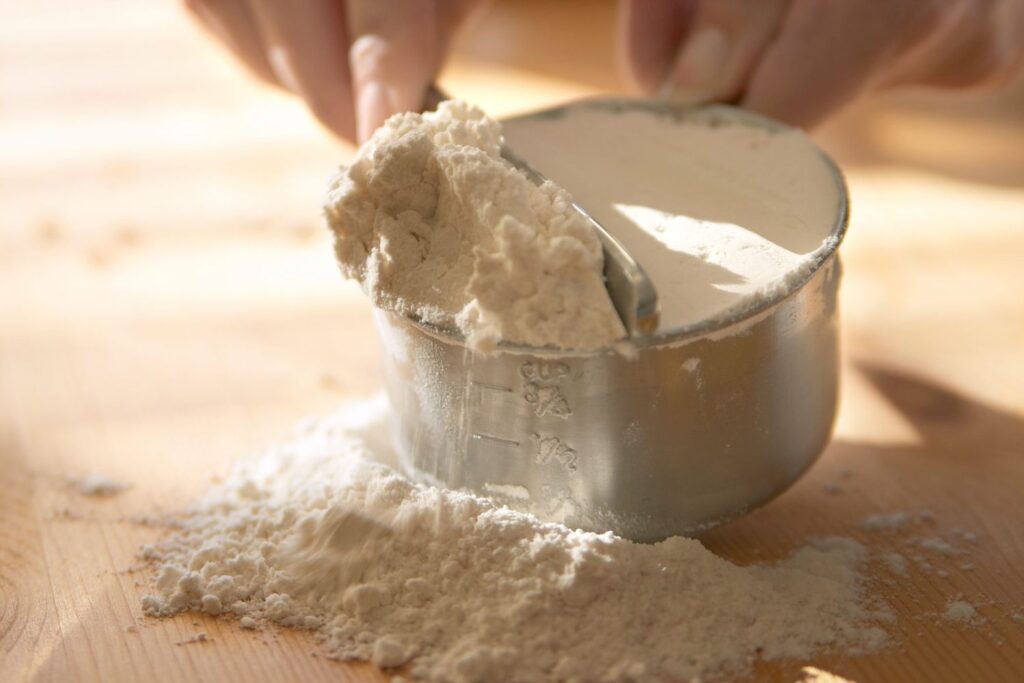 flour into a measuring cup using a spoon, leveling it off with the back of a knife to ensure the right amount. This step ensures the banana bread turns out soft, tender, and deliciously moist, without being dry or dense."This text keeps the focus keyword "moist banana bread" while explaining the importance of properly measuring flour