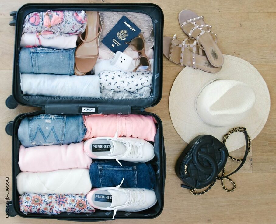 A well-organized suitcase packed for a stress-free travel plan, with essential items neatly arranged, including clothing, toiletries, and travel accessories. Ideal for those seeking a smart and efficient packing guide to make their travel experience smoother.