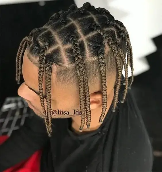 Close-up of Box Braids for Men featuring bold, square-shaped braids. This defined style offers a full, standout look, perfect for medium to long hair.