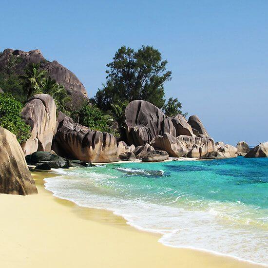 A breathtaking view of Anse Source d'Argent on La Digue, Seychelles, featuring smooth granite boulders, soft white sand, and clear turquoise water, showcasing one of the Best Beaches in the World.