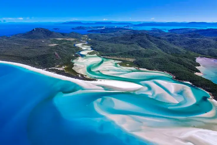 Stunning aerial view of Whitehaven Beach in the Whitsunday Islands, Australia, showcasing crystal-clear turquoise waters and pristine white sand—truly one of the Best Beaches in the World.